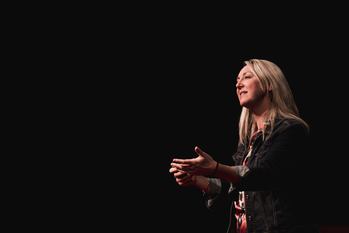 Sally Z delivering keynote on overcoming self-doubt
