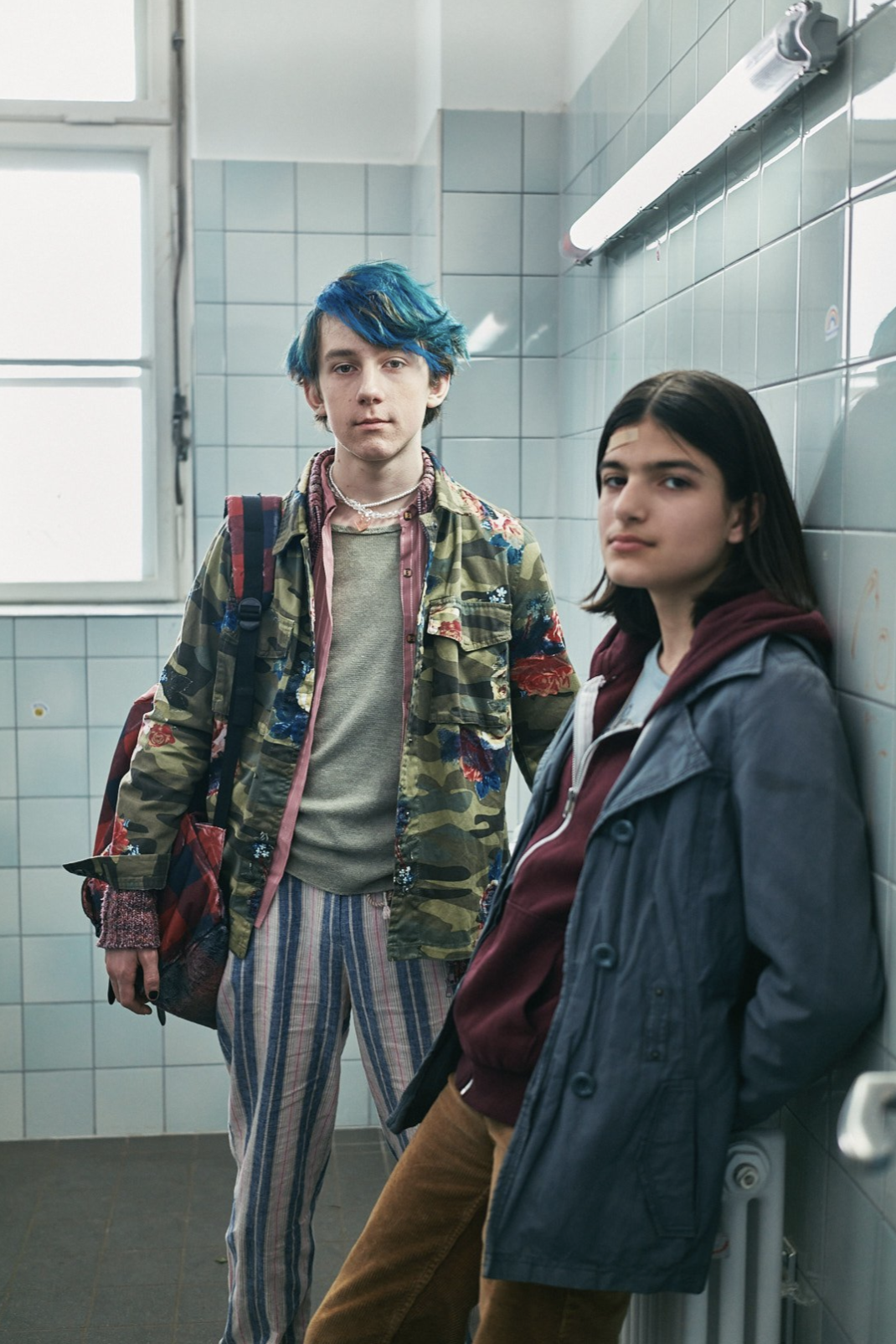 A stylized studio portrait with dramatic fall-off and focus.