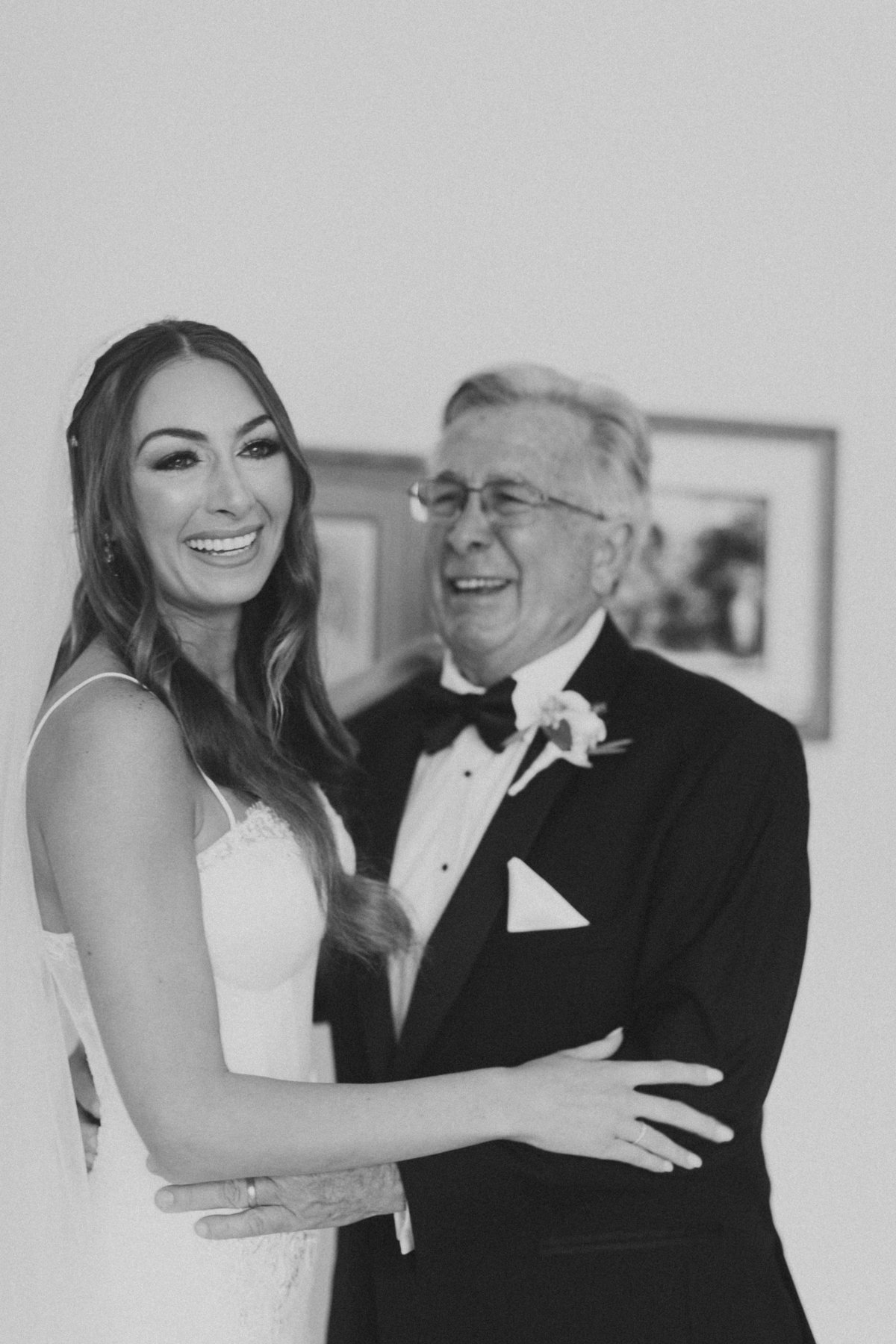 bride hugging father during father first look at philadelphia wedding