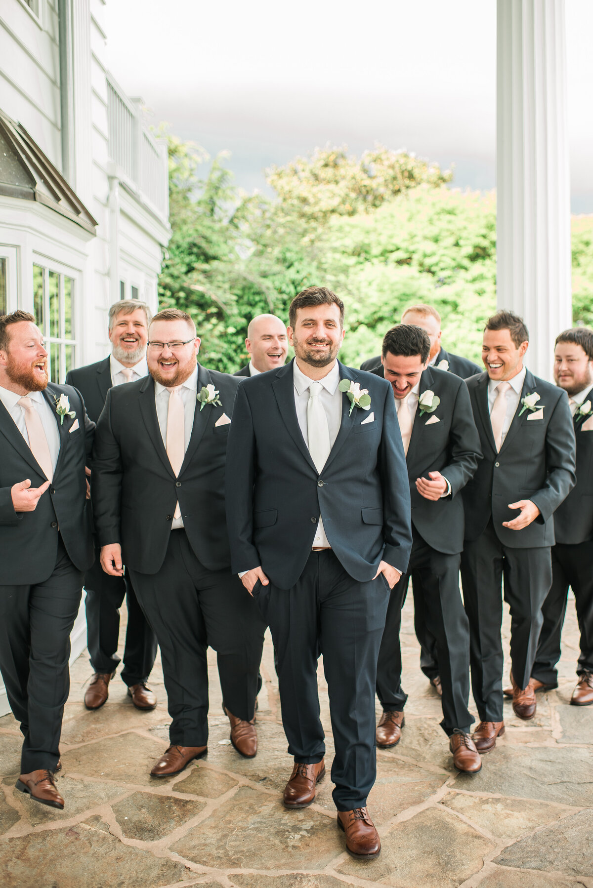 Group of groomsmen walking at bohemia overlook maryland wedding