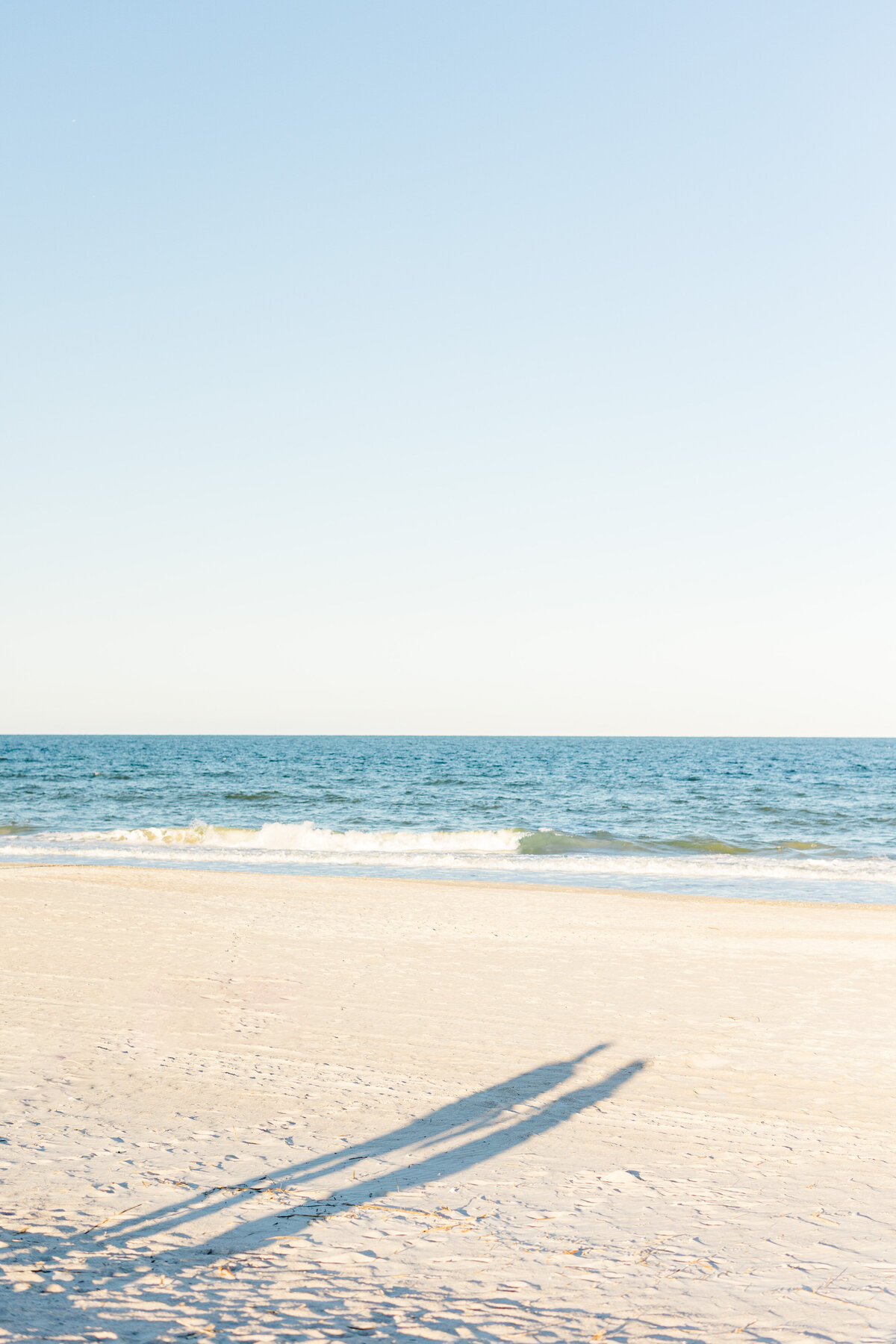 shadows of couple on beach on amelia island