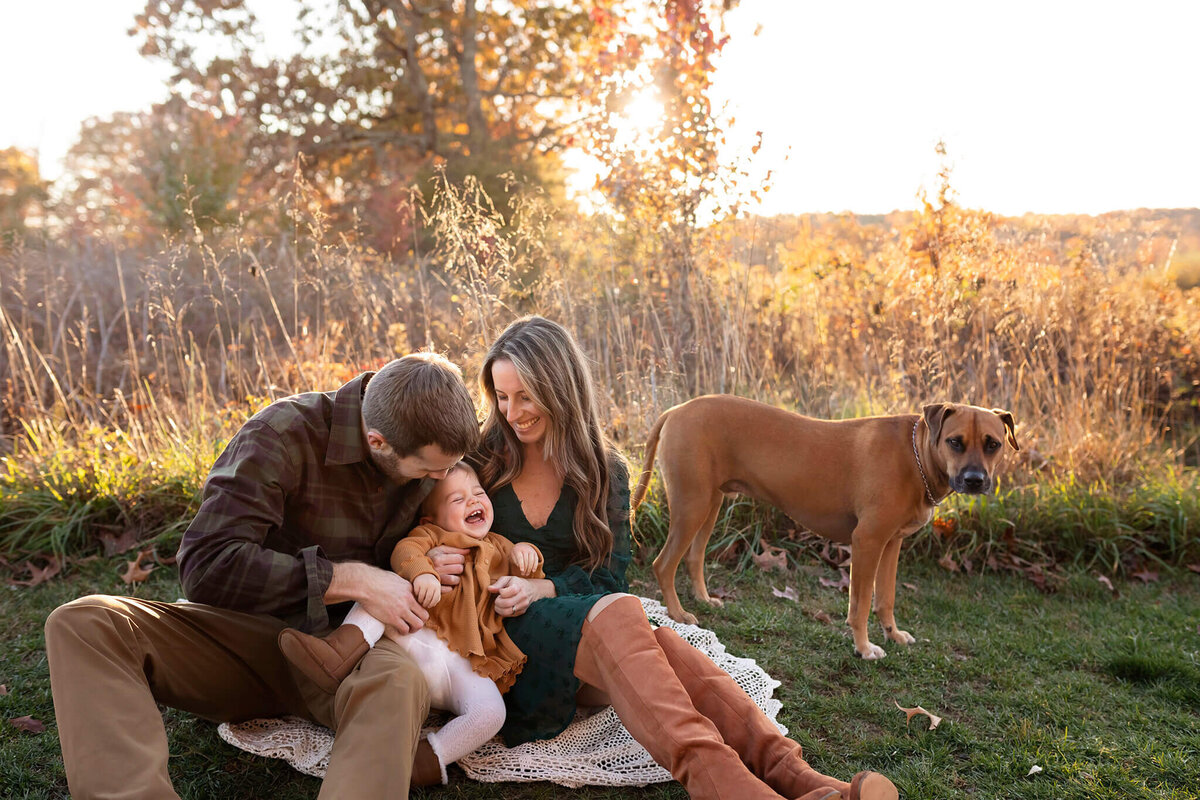 portrait photos of family laughing together in NJ park