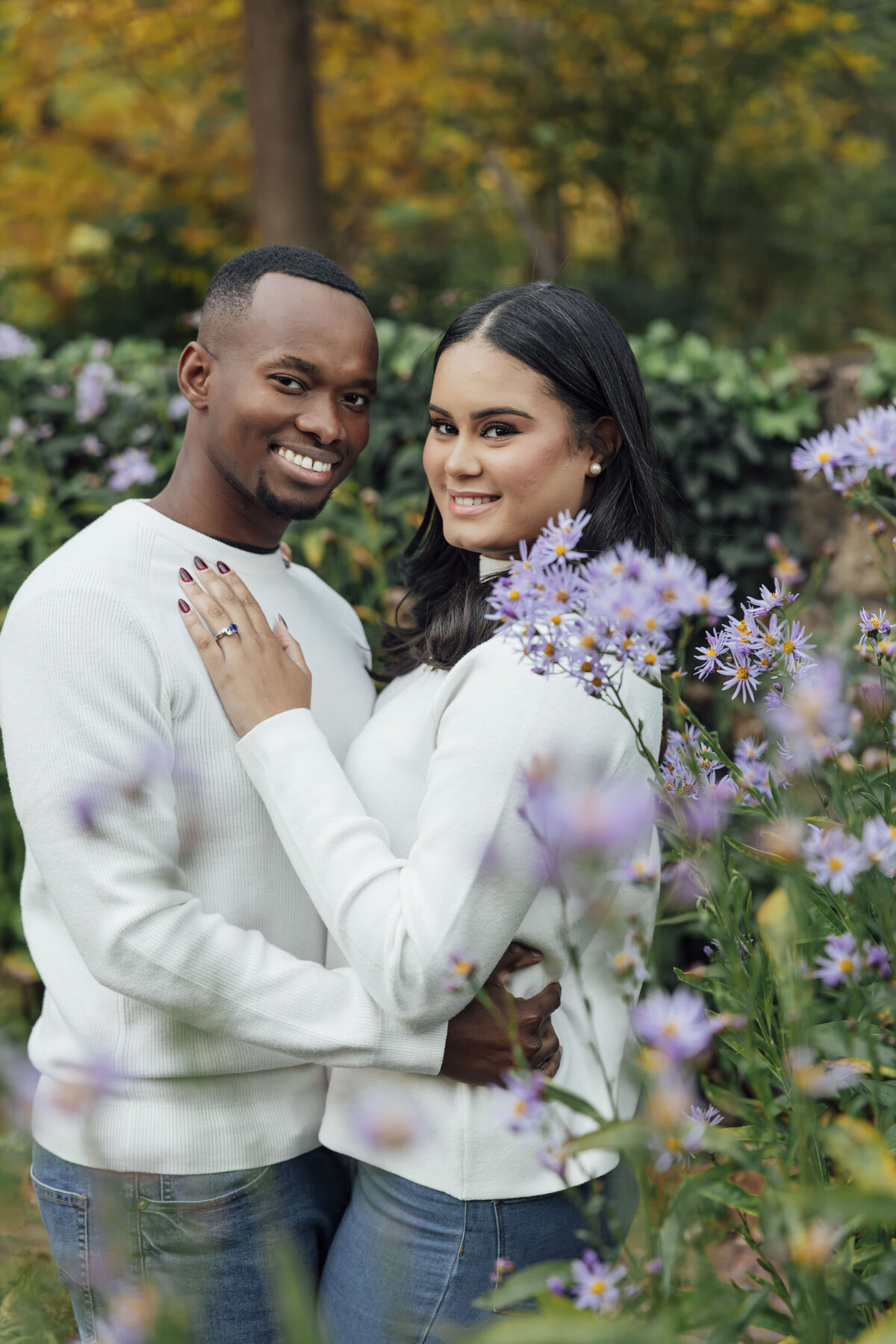 Couple posing during summer engagement session at Cross Estate Gardens in Bernardsville Somerset County New Jersey