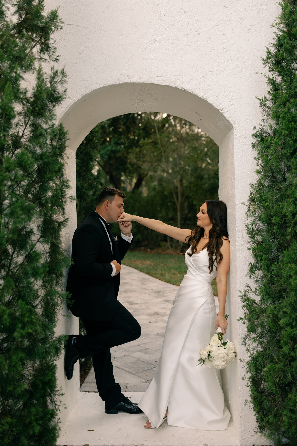 groom kissing bride at La Casa Toscana Wedding Venue Fort Myers Florida