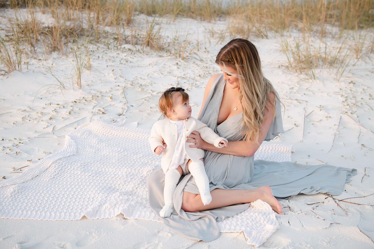 a mother looking at her baby during destin family photography session