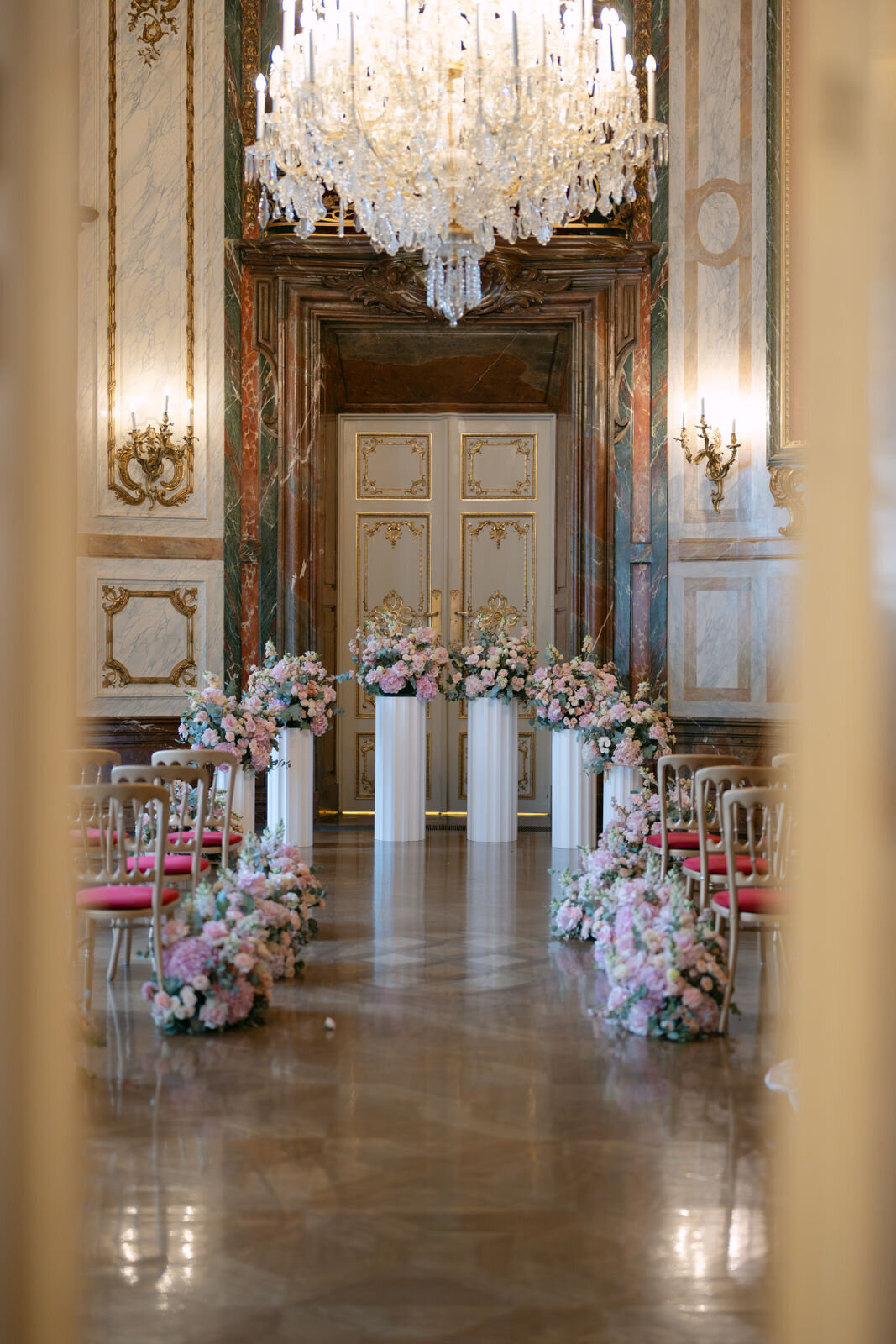 elegant floral wedding aisle decorations at palace Daun Kinsky by ECLAT Destination Weddings