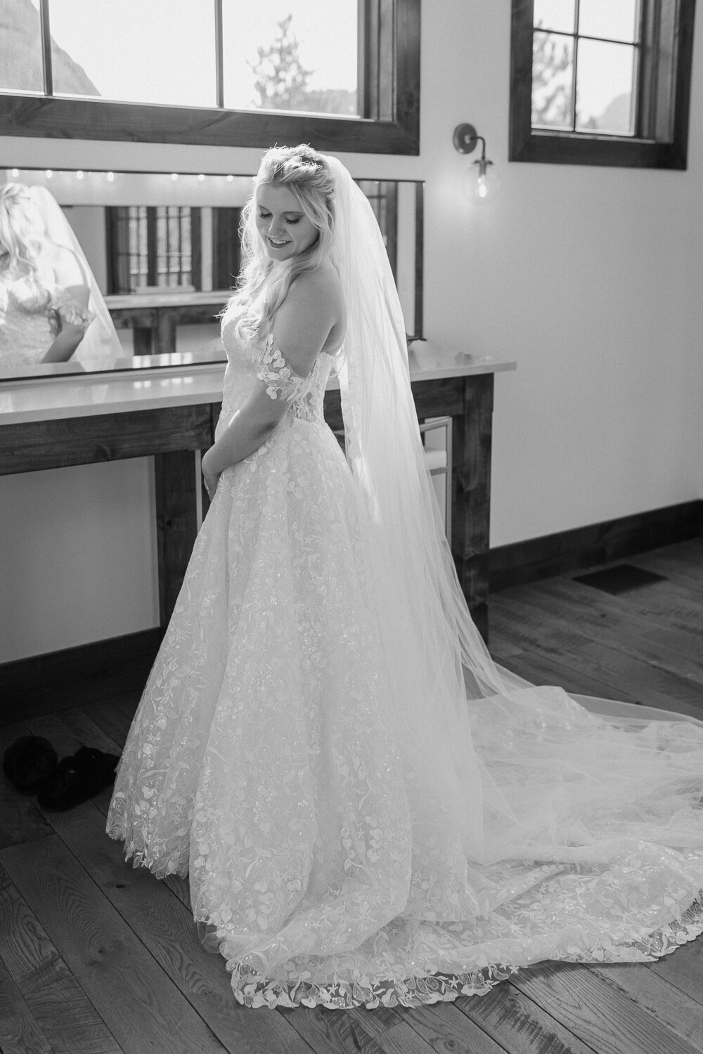A bride poses for a photo during her Estes Park Wedding.