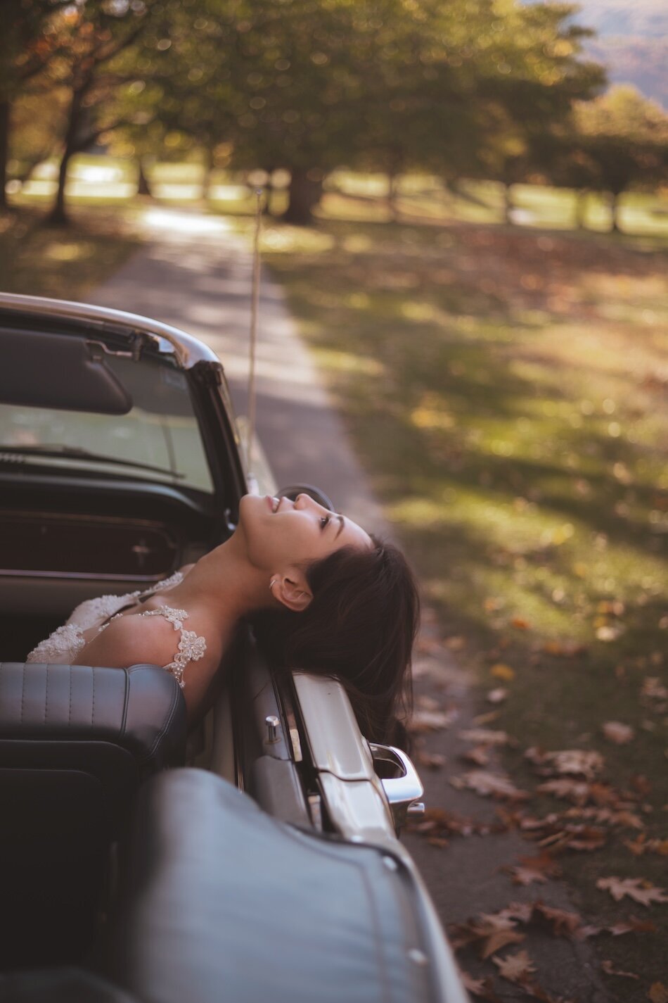 Autumn wedding shoot at Millbrook, Arrowtown. Vintage car & helicopter.