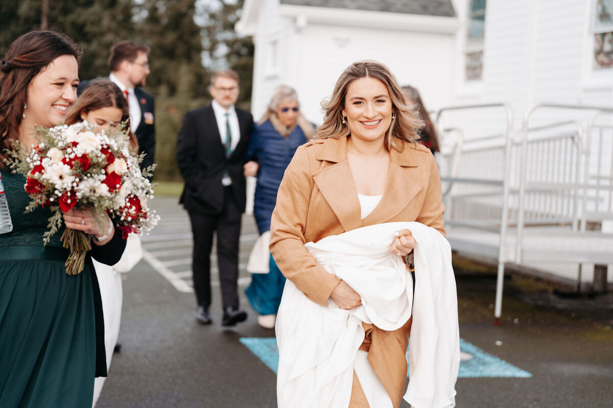 a bride carrying her dress to a church