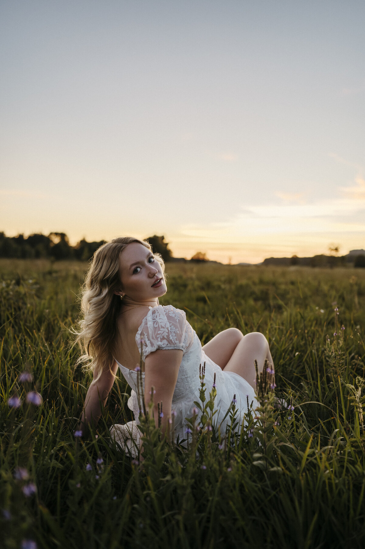 Girl in a field at sunset