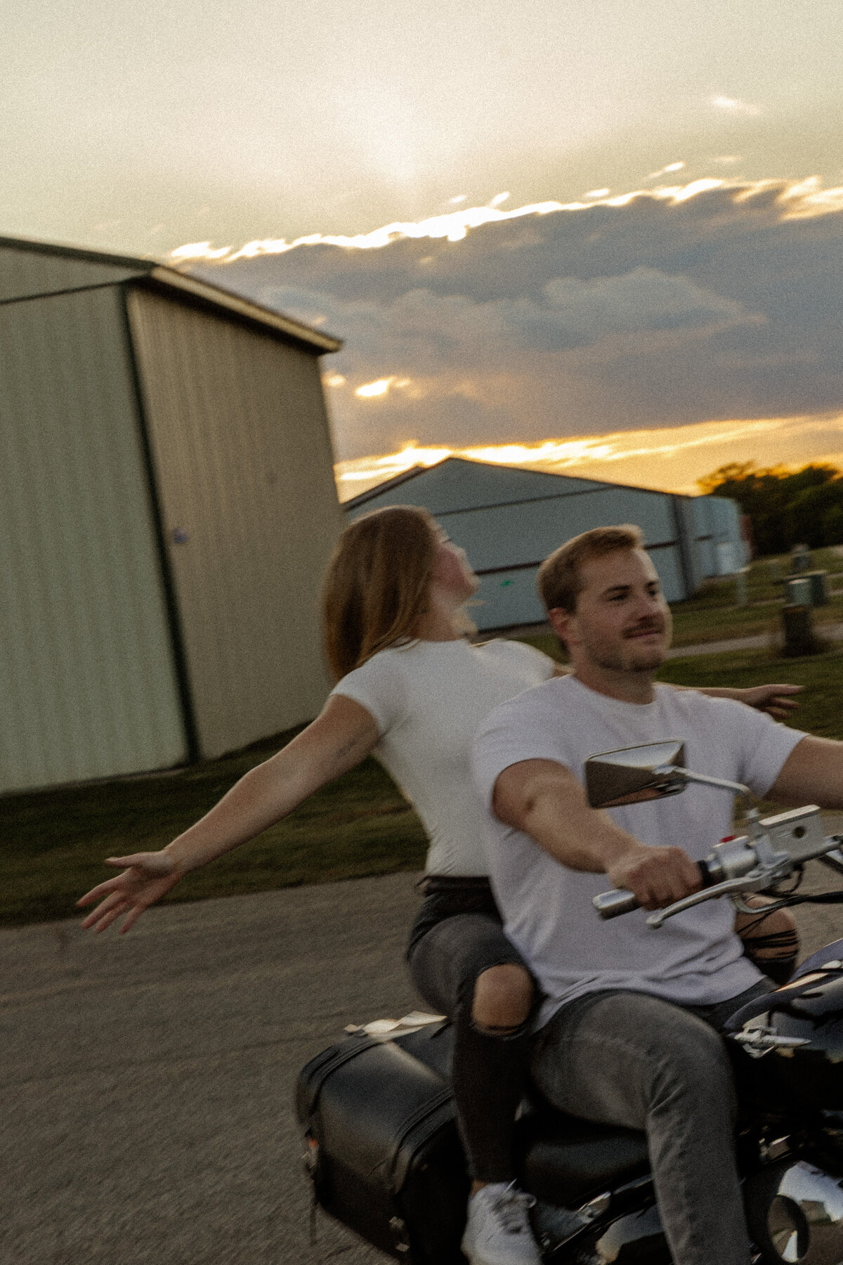 Couple Riding their Motorcycle at Sunset evoking a feeling of freedom and free spirits 
