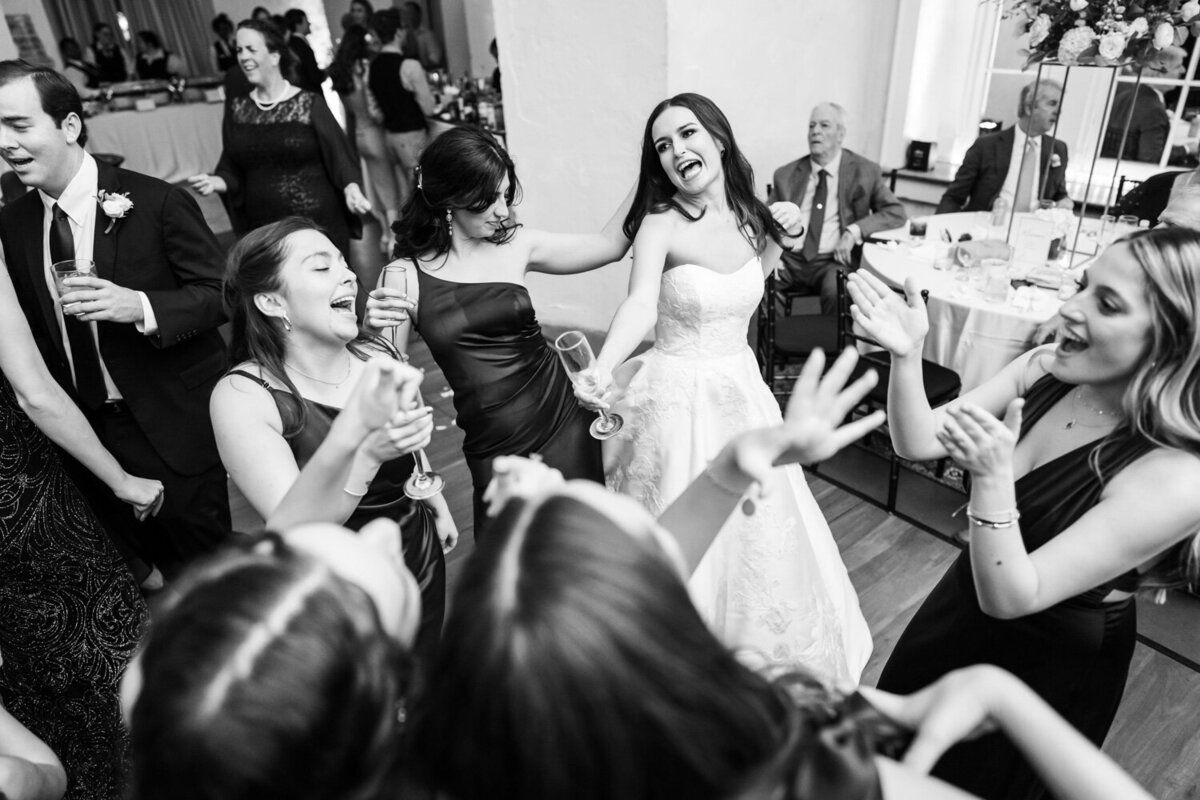 Bride and bridesmaids having fun at reception