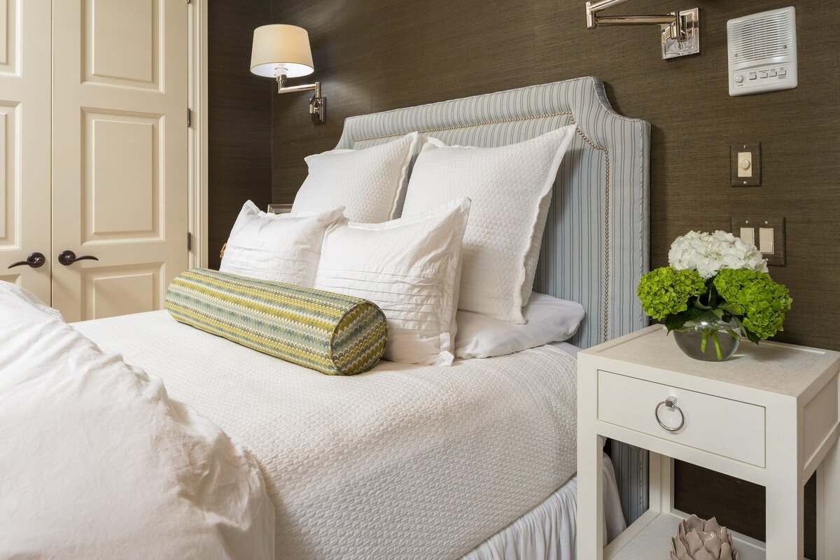 the keeping room interiors grandview bedroom with white pillows and round accent blue and green pillow