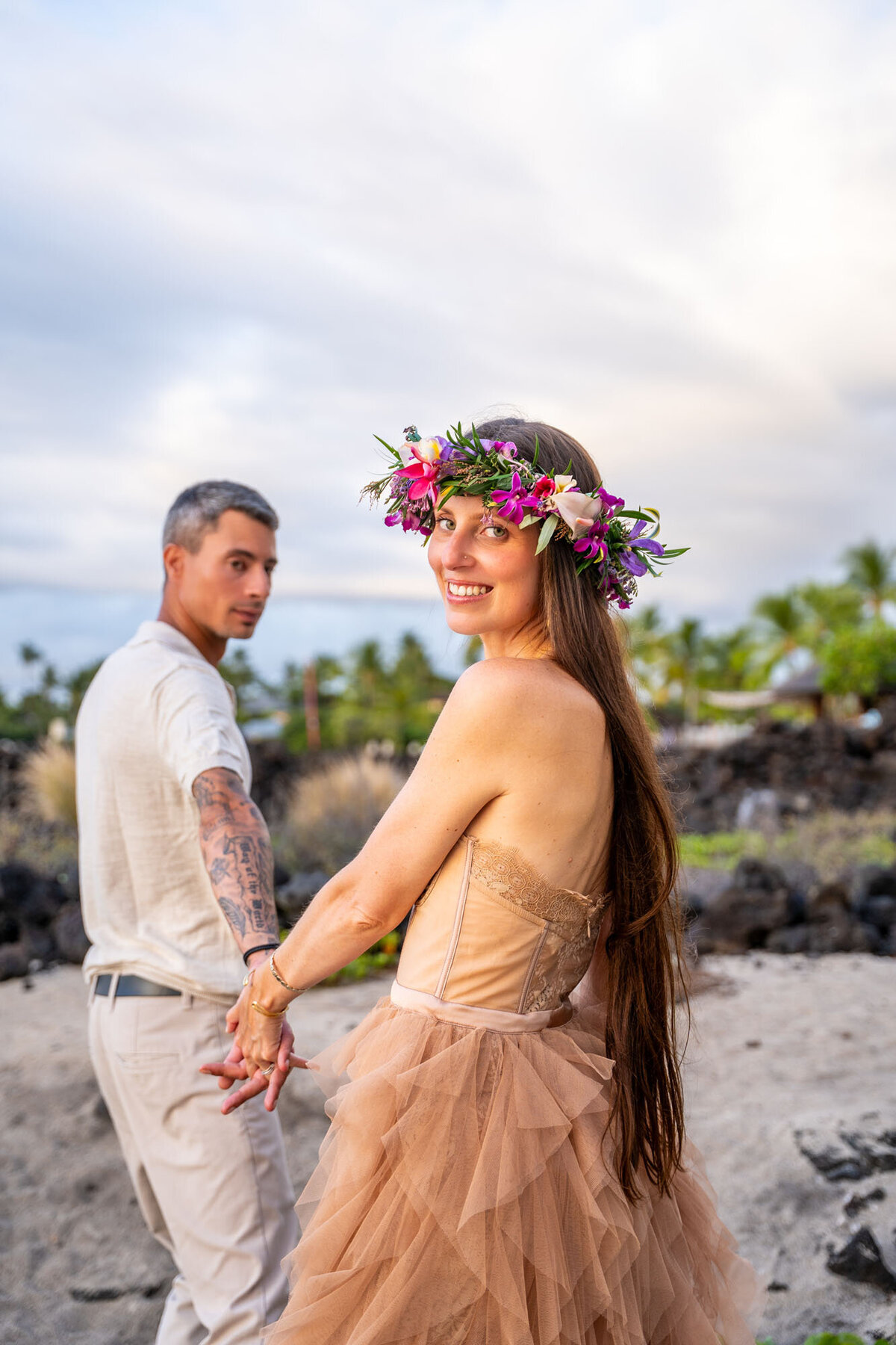 Hawaii couple photography with woman wearing haku lei on the beach