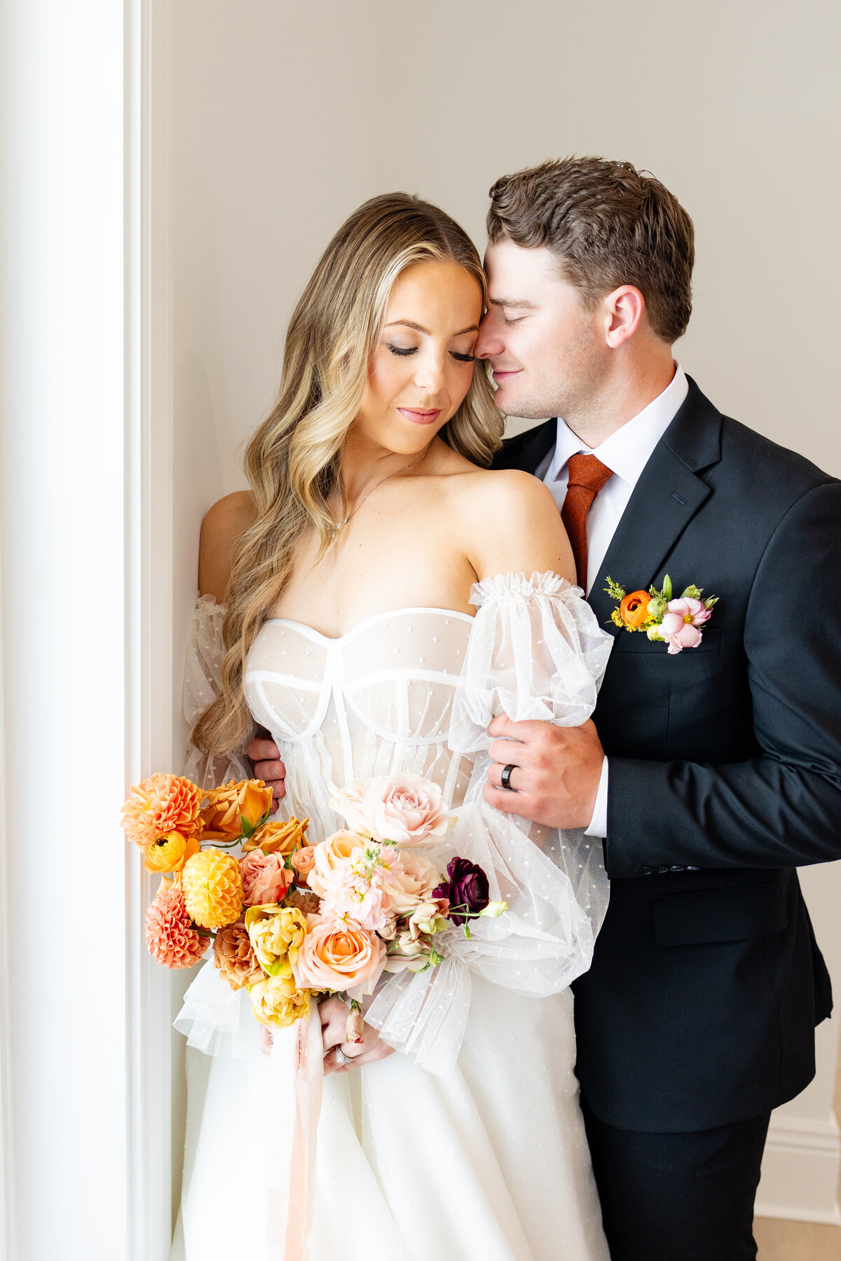 While at their wedding at the Magnolia in South Jordan Utah, bride and groom share a quiet moment together