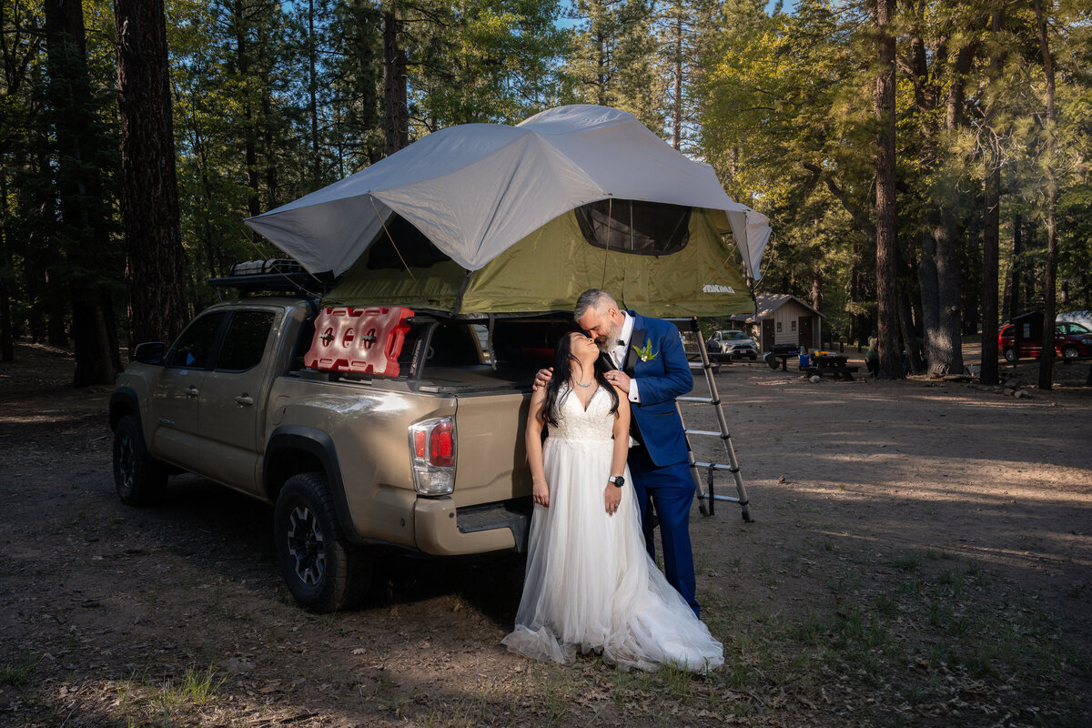 Bride and Groom eloping at Big Bear Buttercup Campground with Toyota rooftop camper truck.