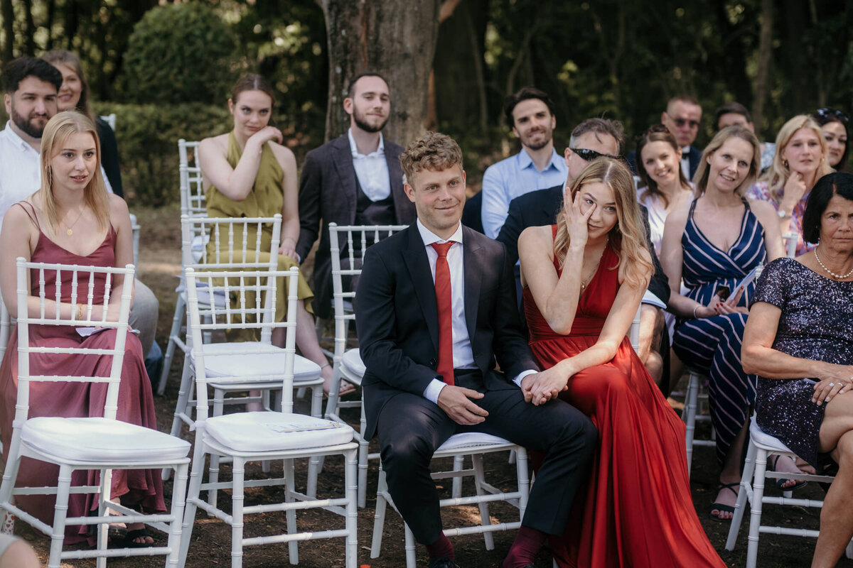 The emotions take over the guests during the wedding ceremony.