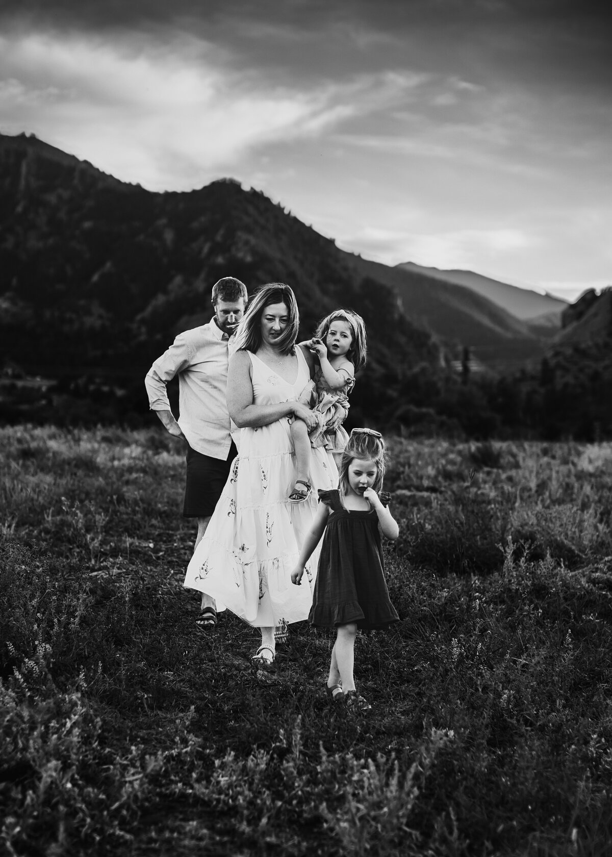 Black and white family picture at sunset in a field in Denver by Erin Jachimiak Photography