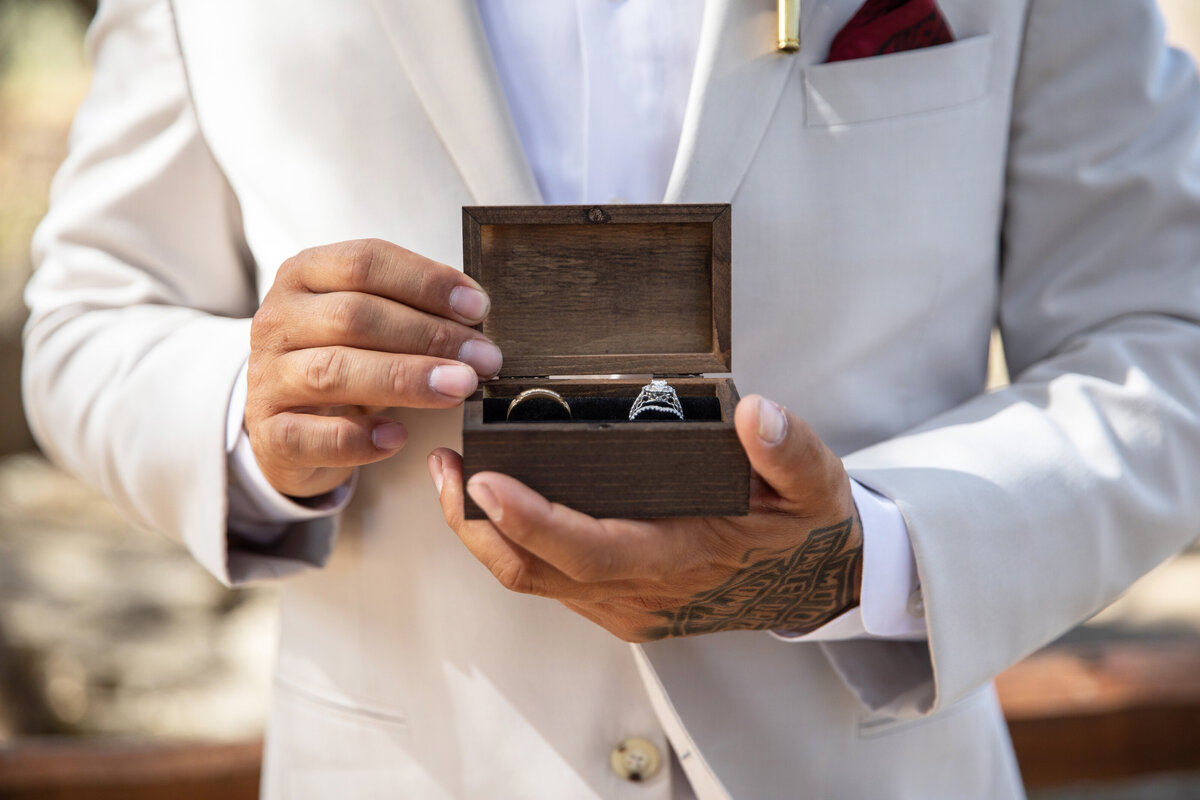 groom with ring box