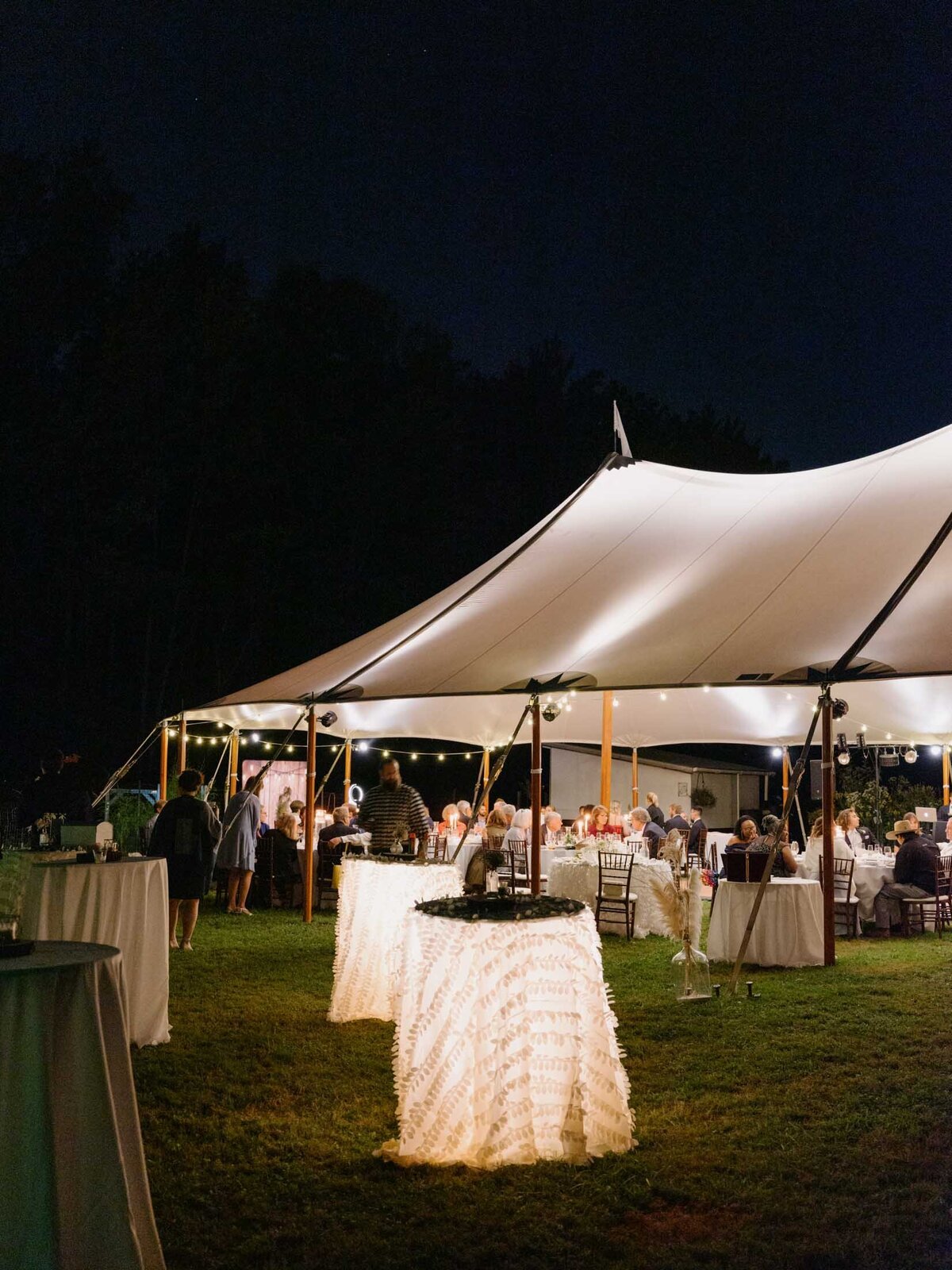 Elegant tented reception at private estate wedding.