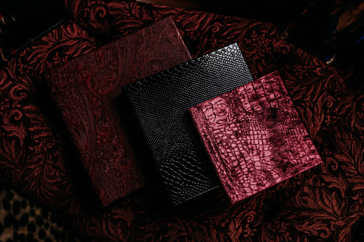 Boudoir photography three keepsake albums on couch in Lubbock, Texas photographer in Amarillo TX
