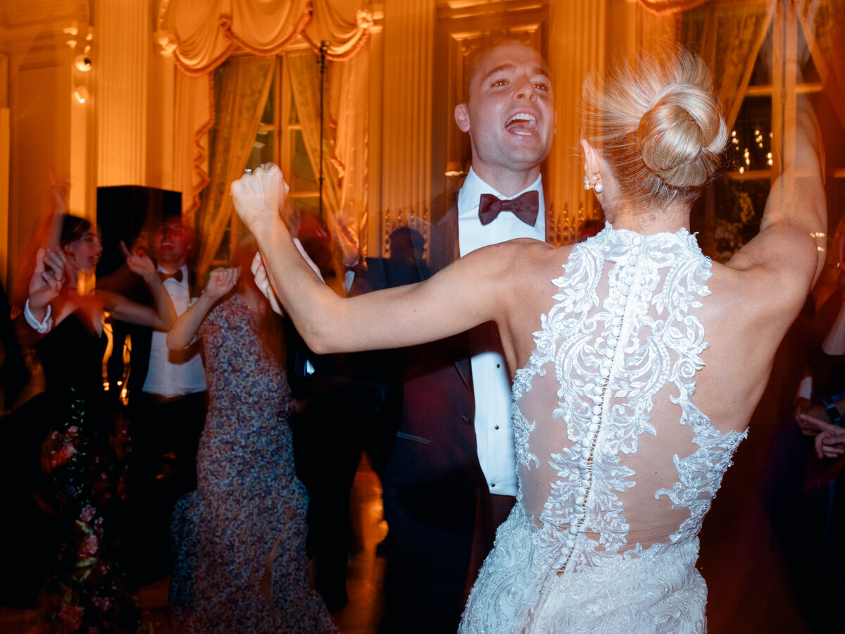 Trendy blurry open dancing photo of the bride and groom.
