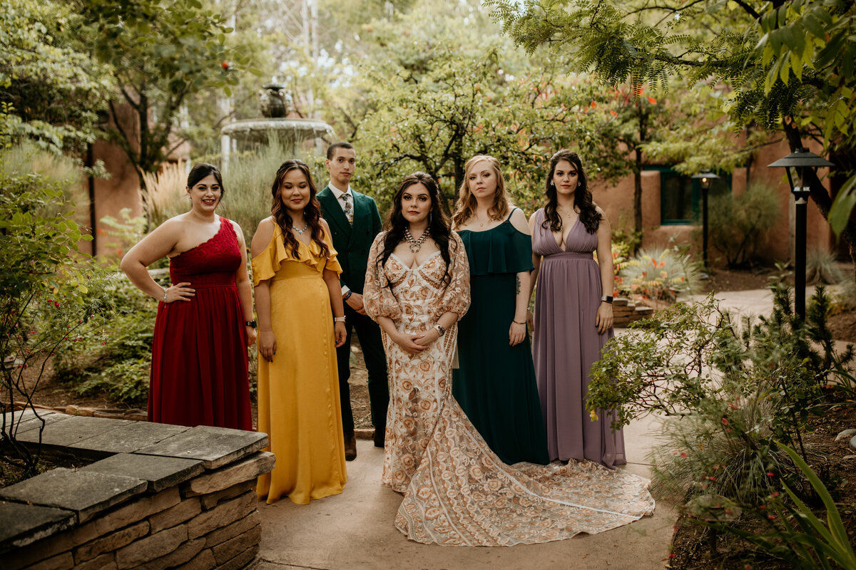 bride with bridal party in jewel tone outfits