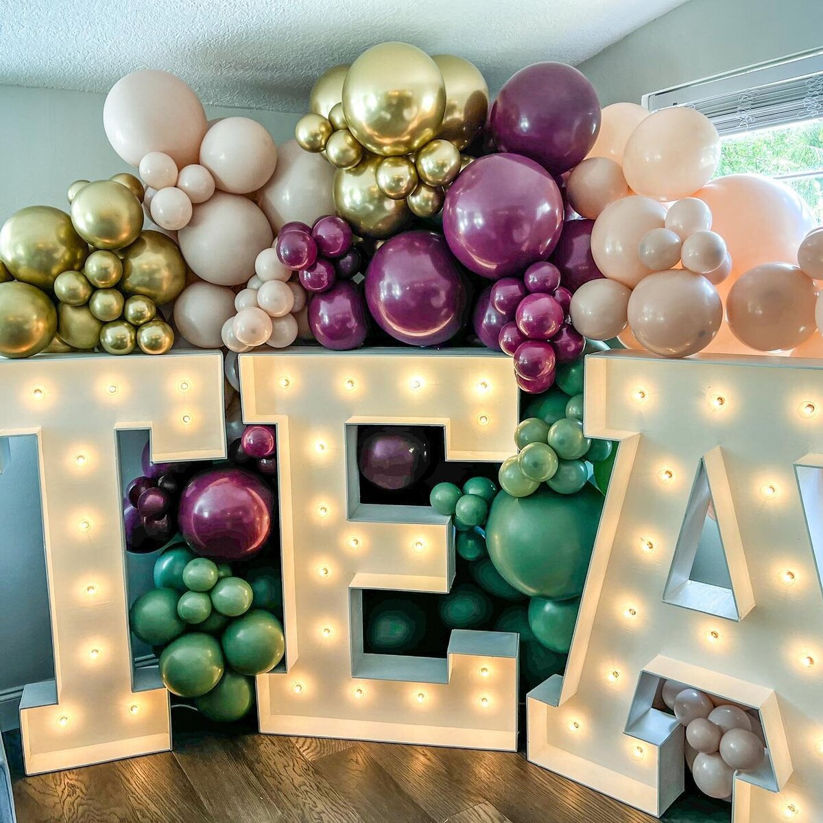 marquee letters and numbers with balloons