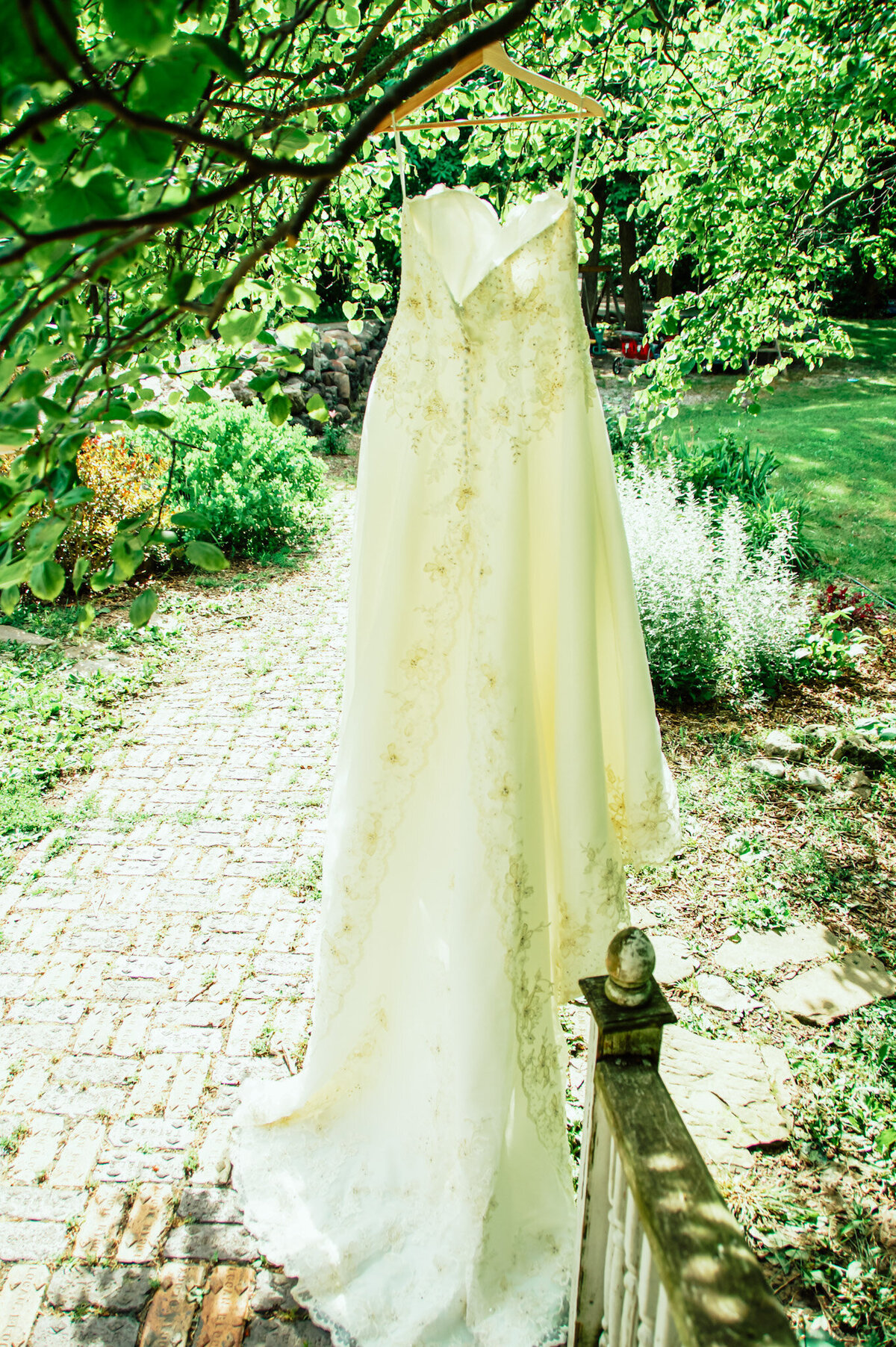 Toledo bride hangs dress before outdoor wedding