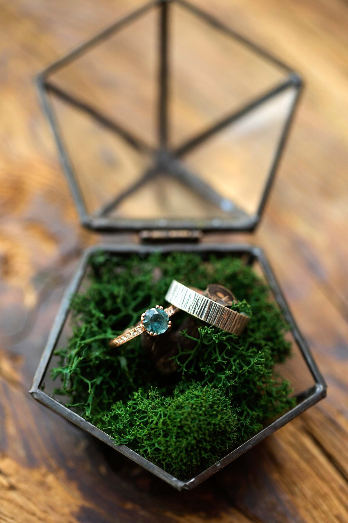 Grooms and Brides wedding rings in glass box with moss. Zigbone Farm Retreat, Maryland