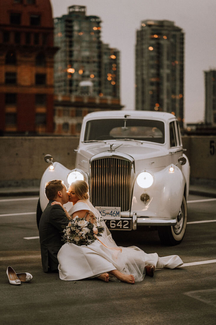 bride and groom with vintage car