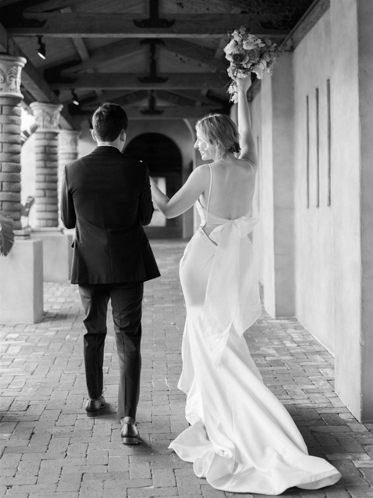 bride and groom walk to reception