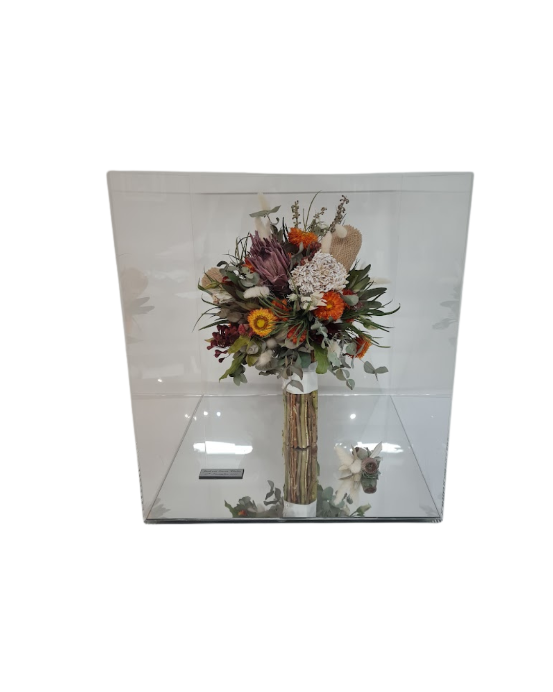 Wedding bouquet preserved inside perspex keepsake.
