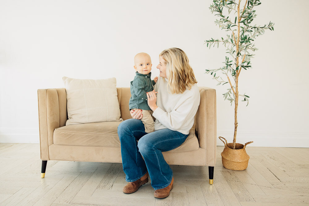 mother smiles at son in utah family photoshoot