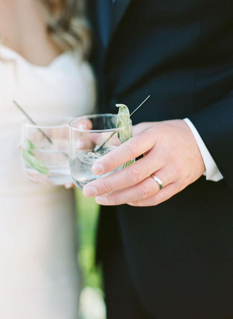 Bride and Groom Holding Cocktails Photo