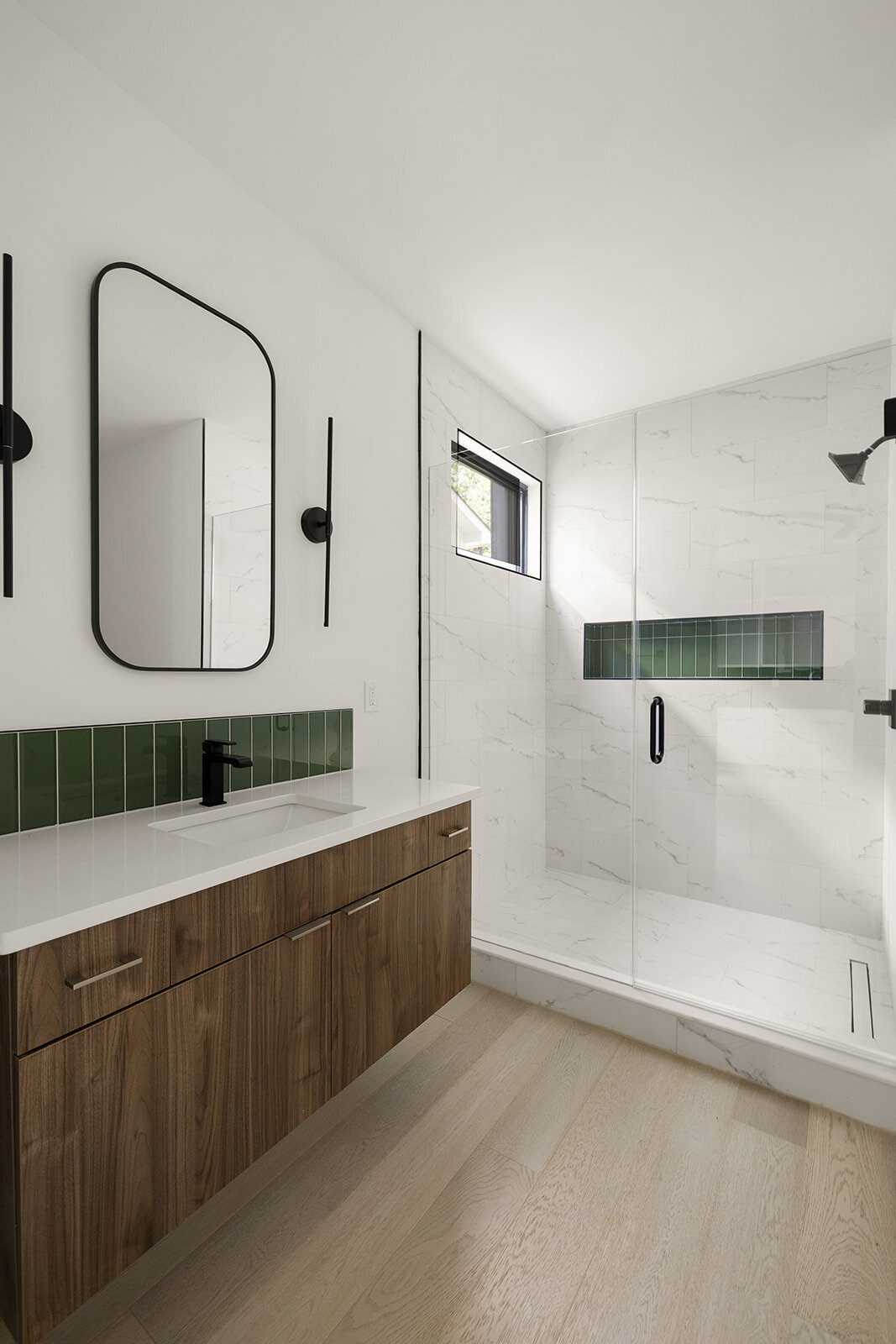 green bathroom tile in shower