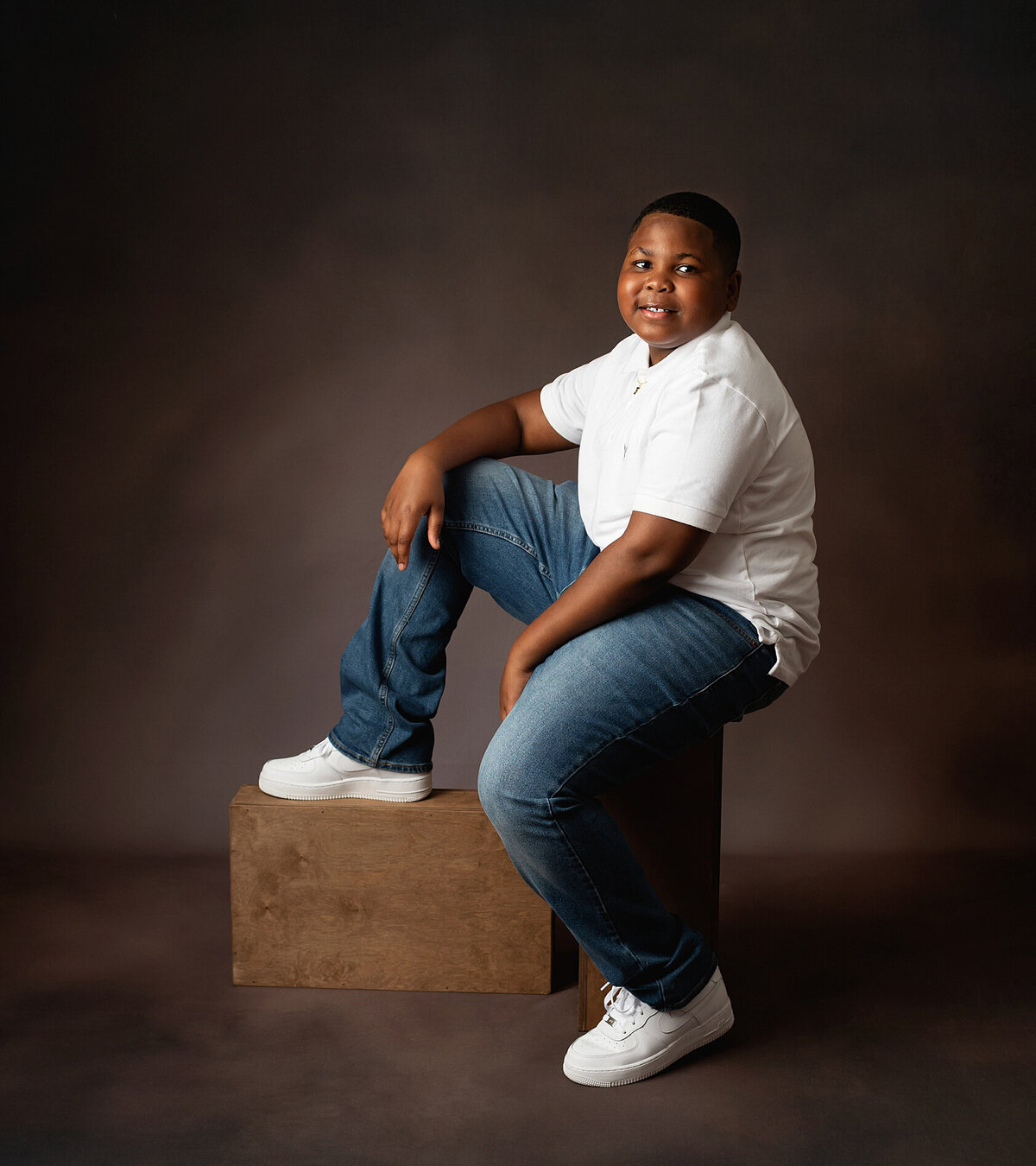 A captivating studio phot session featuring a boy, highlighting their unique personality and features.