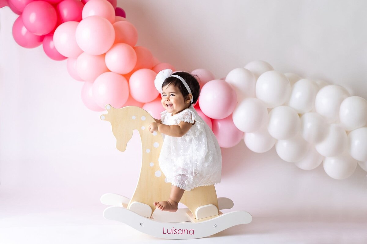 baby on rocking horse pink ballooms