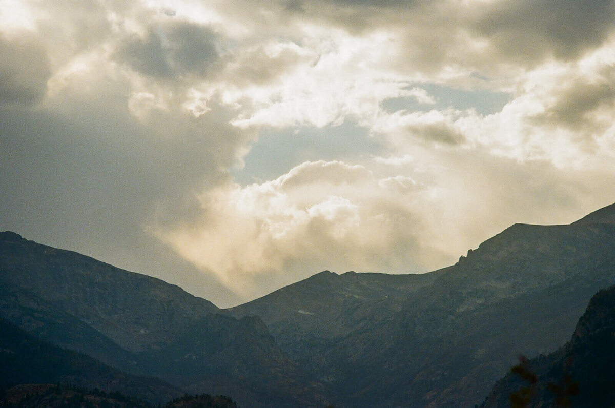 setting the scene with a photo of the clouds over the mountains
