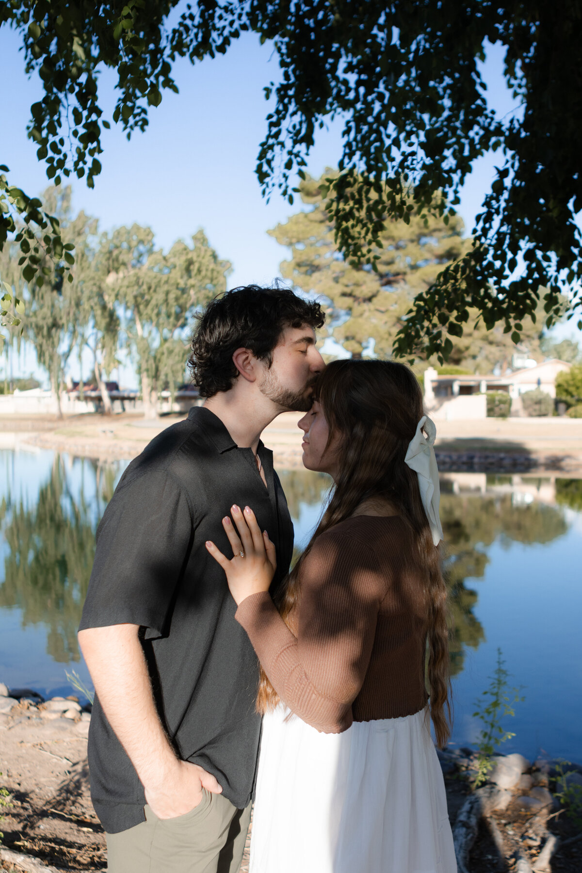 Jovanna G Photography. Classic, sophisticated Wedding Photos. Soft romantic engagement photos. Soft romantic WeddingPhotos. Sophisticated Wedding Photographer. Professional Wedding Photographer. Destination Wedding Photographer. Luxury Wedding photographer. Traveling Wedding Photographer. AZ Wedding Photographer. Gilbert AZ Wedding Photographer. Queen Creek Wedding Photographer. Phoenix Wedding Photographer. Scottsdale Wedding Photographer. Flagstaff Wedding Photographer. SoCal Wedding Photographer. California Wedding Photographer. Northern California Wedding Photographer. Southern California Wedding Photographer. San Francisco Wedding Photographer. Bay Area Wedding Photographer. San Jose Wedding Photographer. Golden Gate Bridge Wedding Photographer. Beach Lover Wedding Photographer. Palace of the Fine Arts Wedding Photographer. Ocean Lover. I love California. Orange County Wedding Photographer. Newport Beach Couples Photographer. Newport Beach Wedding Photographer. Laguna Beach Couples Beach Engagement Photographer. Laguna Beach wedding beach photographer. Los Angeles Wedding Photographer. Young and in love engaged couples who live in southern California. Christian Young Couple. Young Engaged Couple. Engaged High School Christian Couple. Christian Values. Young conservative Christian women. Young Conservative Christian men. Young Conservative Christian Couple. Young Christian Couple Engaged in High School. Young Christian College Couple. Lakeside Lovers in the Autumn Sun. David & Grace - engagement photos. Jovanna G Photographer Engagement Photos. Arizona sun shining through autumn trees- engagement. Chandler, AZ Engagement Photos. Chandler, AZ 2026 bride. Chandler, AZ Wedding Photographer. Chandler, AZ Young Engaged Couple. Girl in her 20s. Engaged Arizona Girl in her 20s. Lakeside Engagement photos. AZ Lakeside Engagement Photos. AZ Weeping Willow Lakeside Proposal. Arizona Lakeside Proposal with weeping willow tree. Detail shot of engagement ring on Arizona Lakeside estate. Chandler, AZ Lakeside Estate Proposal Outfit Inspiration.