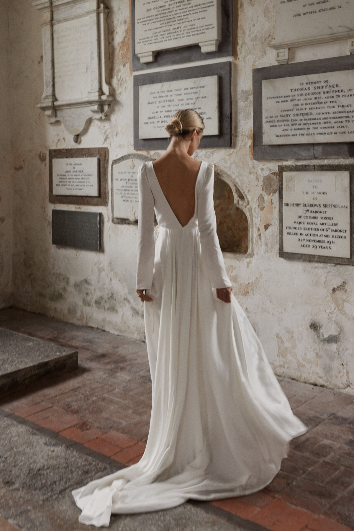 Deep v back silk wedding dress on natural bride in church
