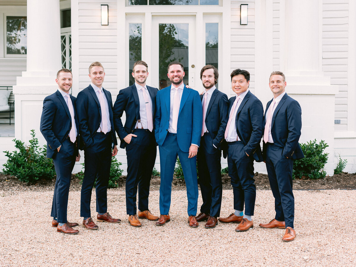 Groom with groomsmen in blue suits for wedding at The Grand Lady Austin
