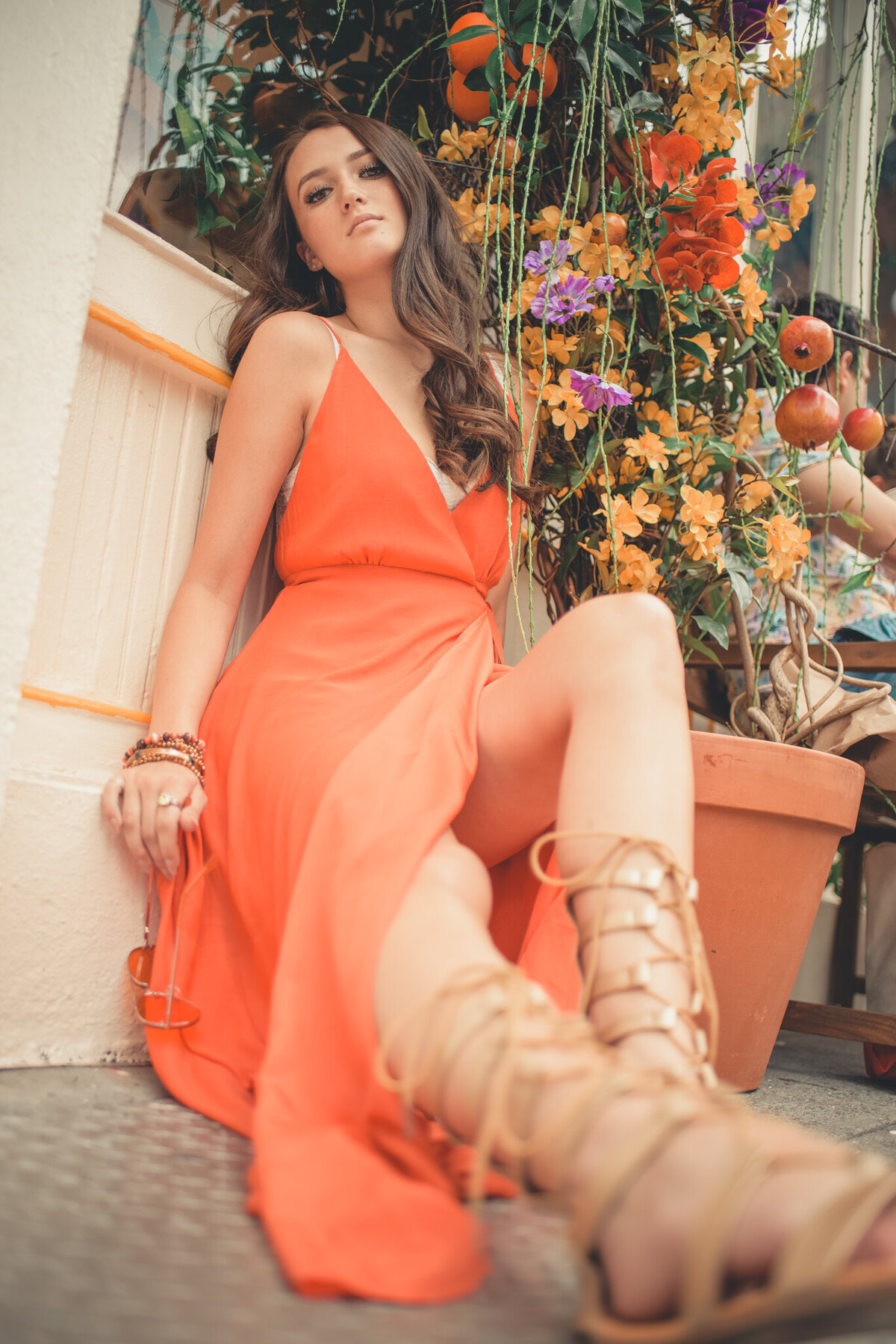 Iowa-woman-posed-in-orange-dress-high-school-senior-pictures