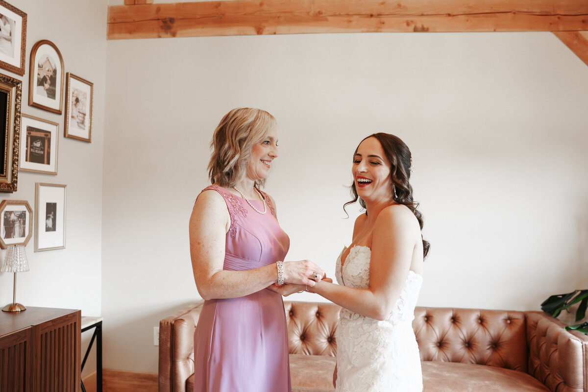 Bride getting ready with her bridesmaids on the morning of her wedding