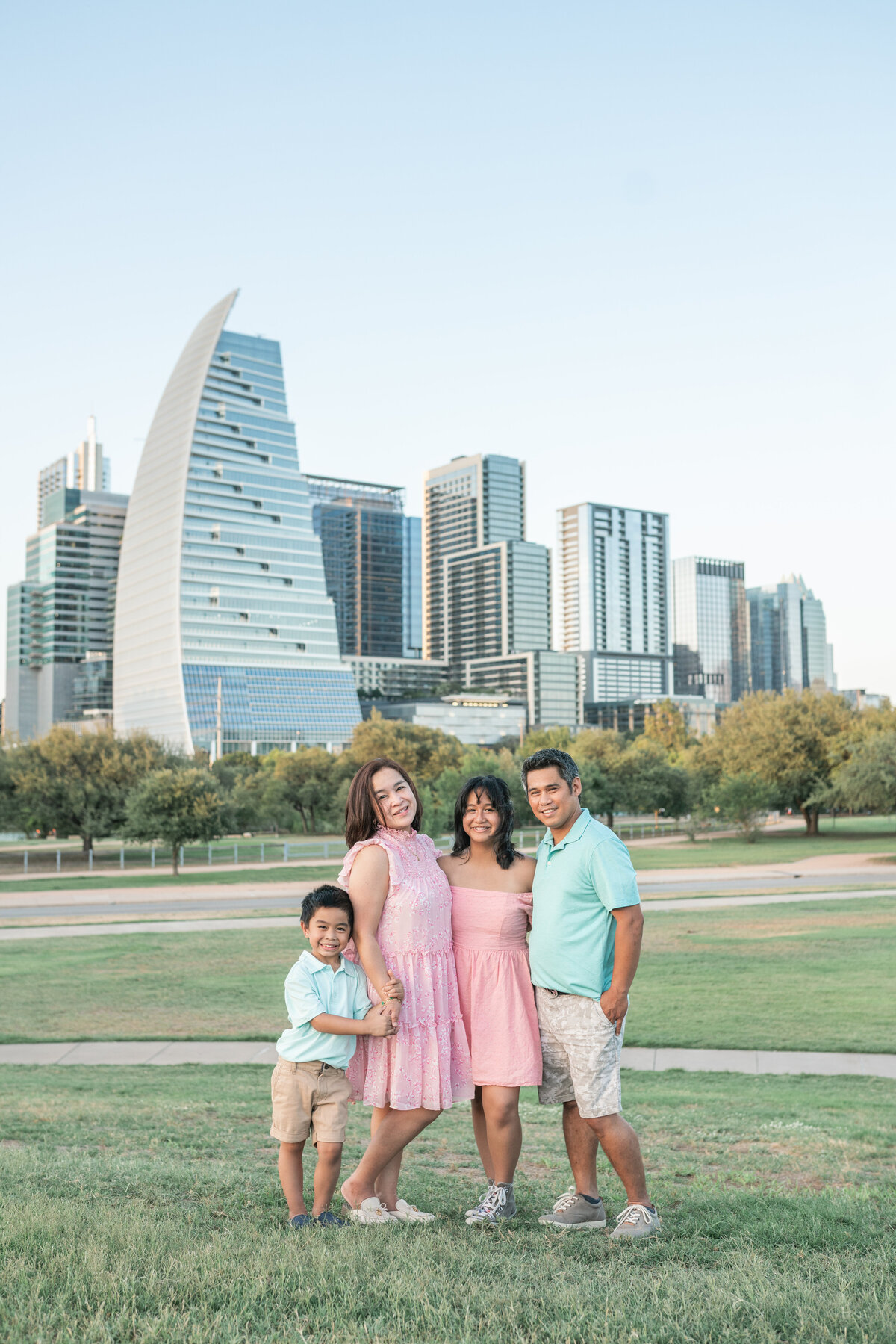Austin Texas Family photo in front of Austin Skyline.