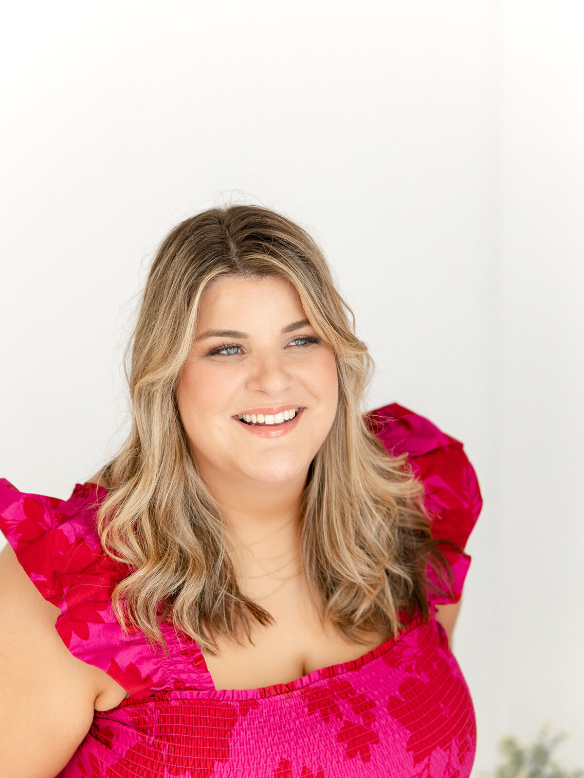 woman posing and smiling during headshot session