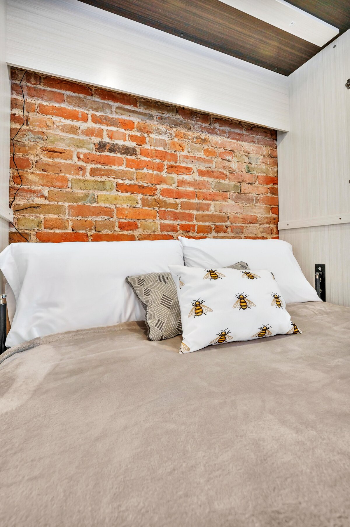 Check out this Murphy bed for two in the living room of this one-bedroom, one-bathroom vintage condo that sleeps 4 in the historic Behrens building in the heart of the Magnolia Silo District in downtown Waco, TX.