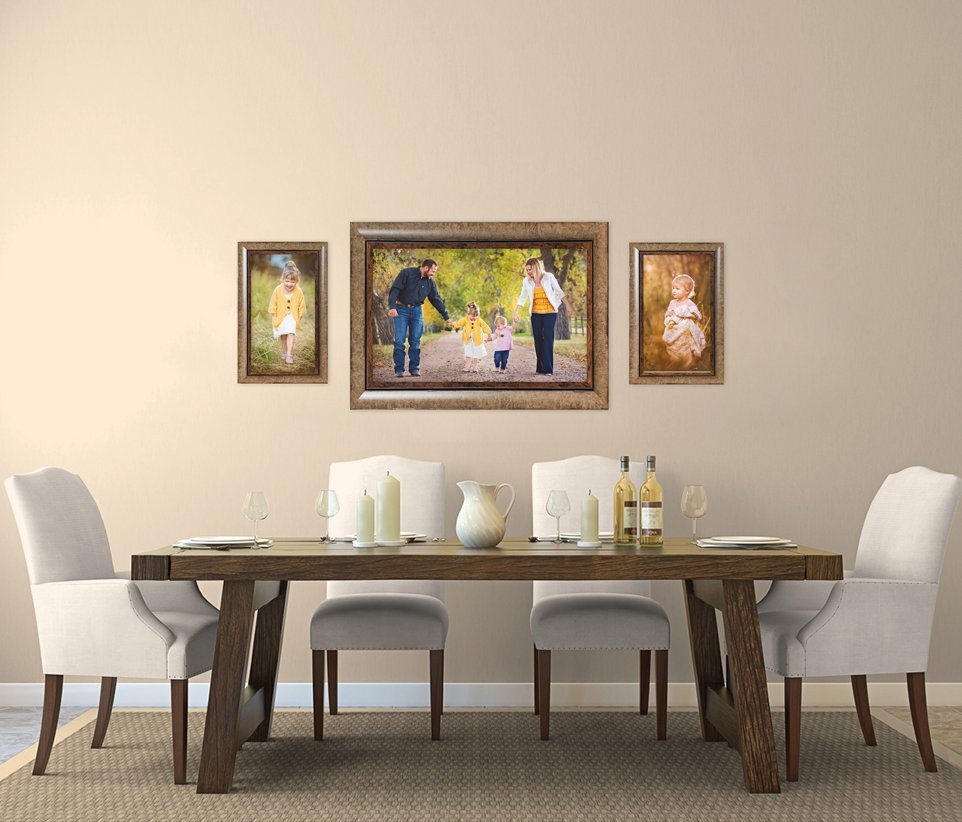 Dining room in Laramie with a farmhouse style decor with three family portraits.