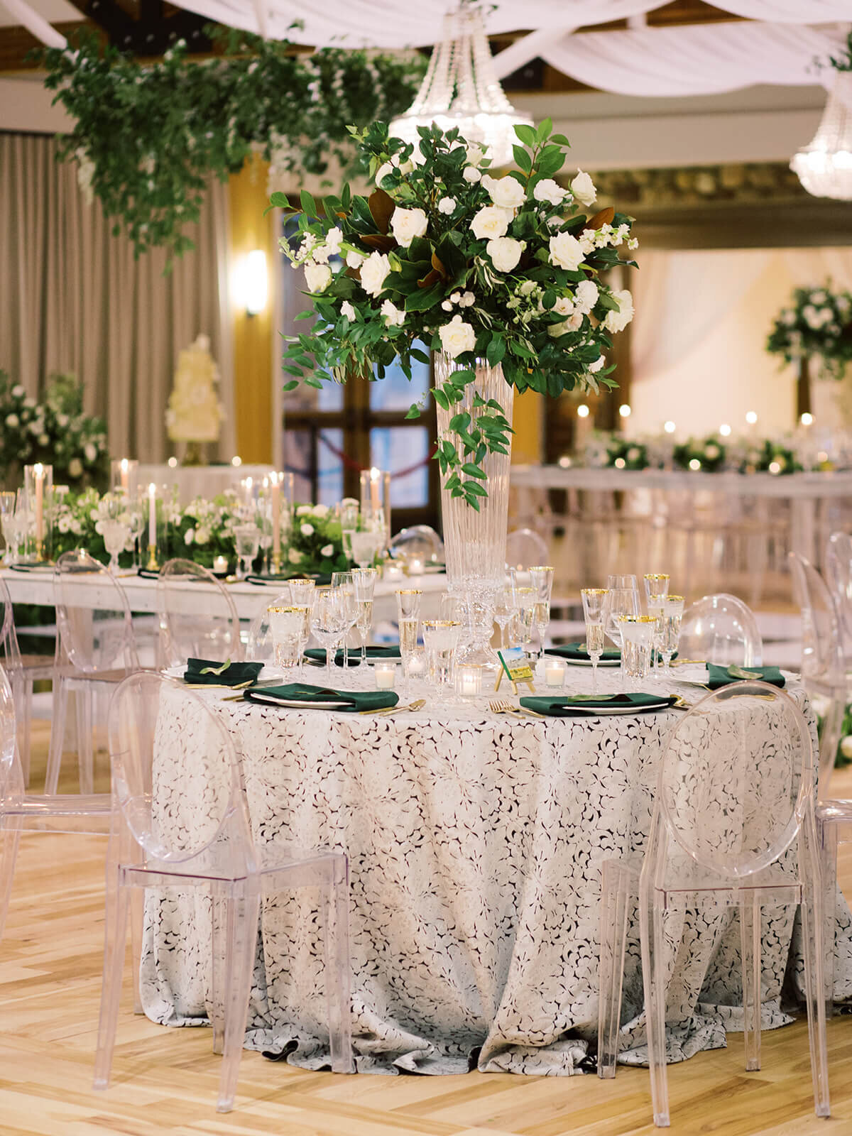 Wedding tables under custom floral garlands and arrangements in Colorado