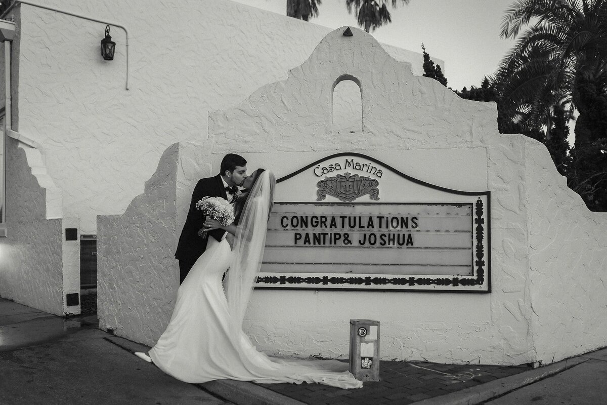 This timeless black-and-white portrait at Casa Marina was captured by Phavy Photography, a Jacksonville wedding photographer. With the venue’s historic architecture as the backdrop, the bride and groom share a quiet, romantic moment. Phavy’s signature blend of luxury and documentary style makes this image perfect for couples seeking refined, heartfelt wedding photography in Jacksonville.